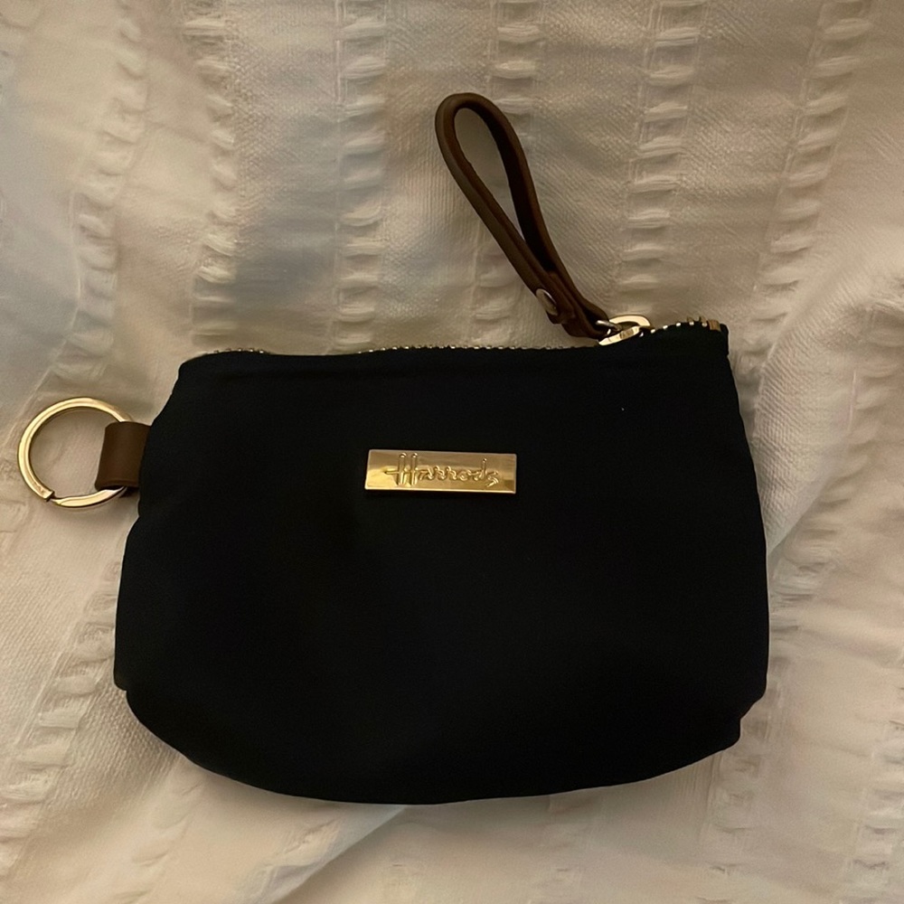Harrods change pouch bought in England.